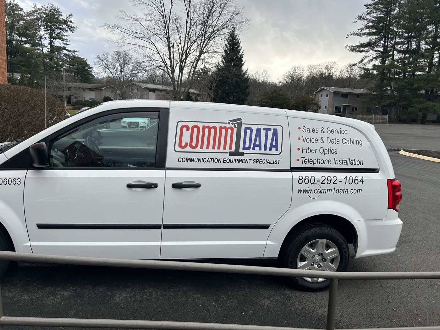 Comm1data service van with the company's voice, data and fiber services on the side